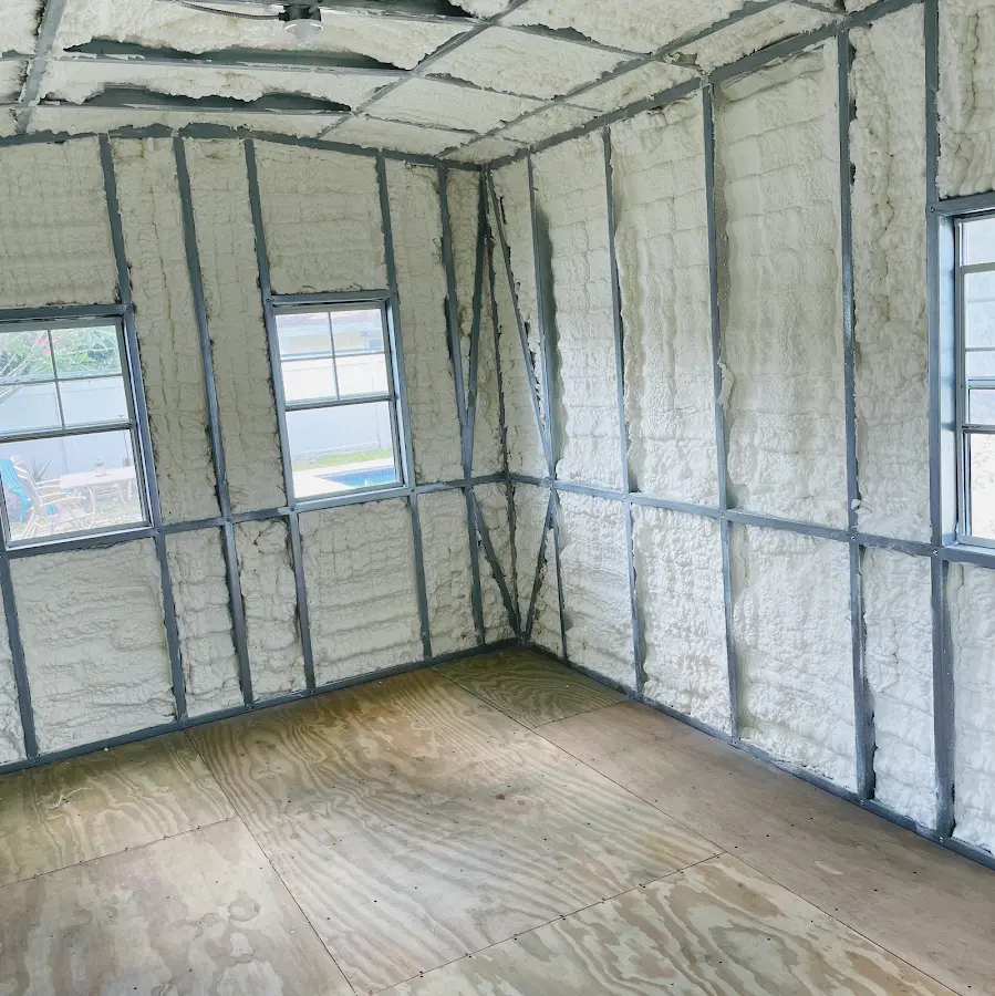 Closed-cell spray foam insulation applied to wall cavities in a residential project in Sunnyside